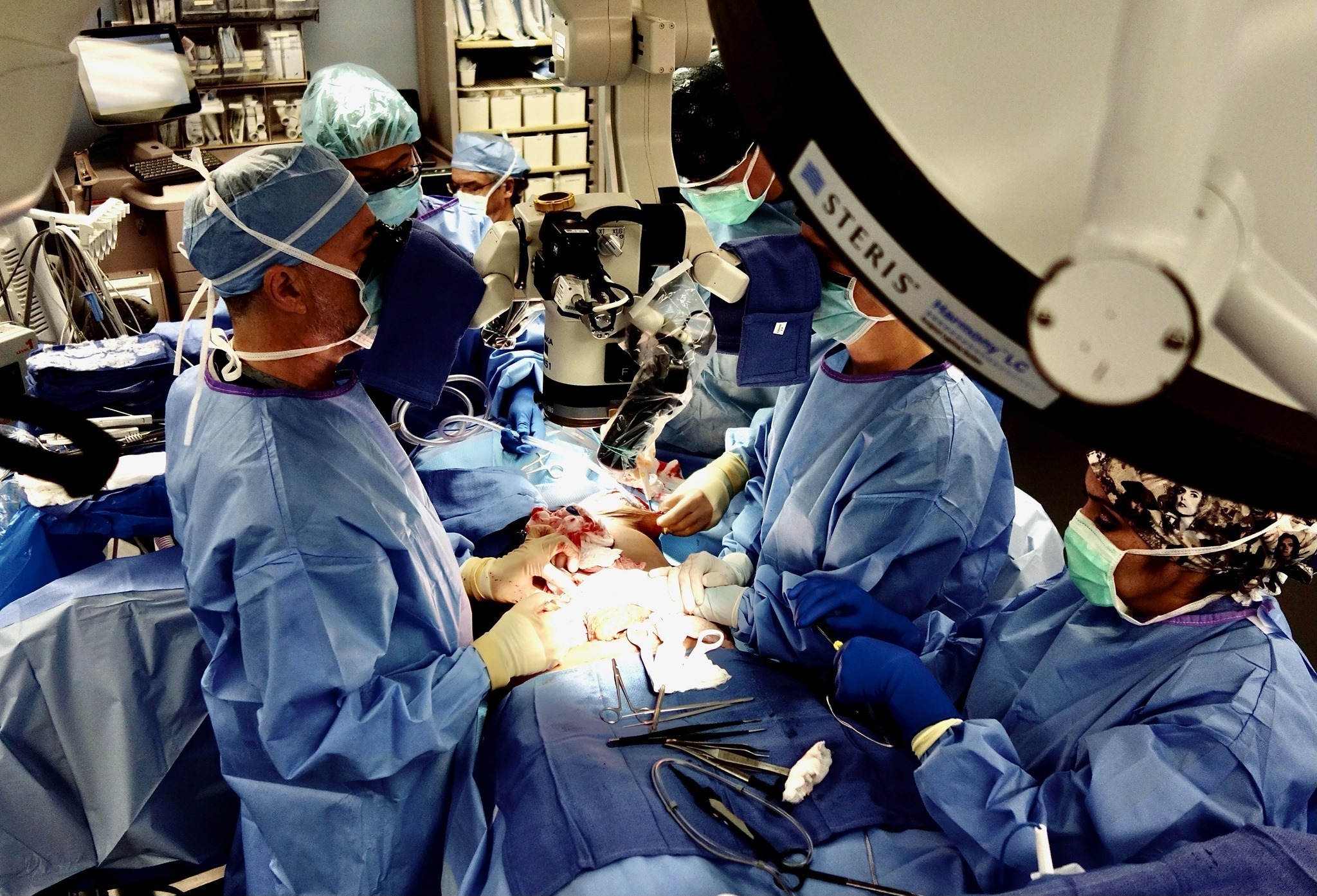 Surgical team and surgeon conducting a diep flap reconstruction in an operating room